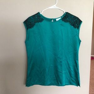 Green sleeveless blouse